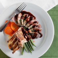 Rack Of Lamb  · with gratin potatoes and green beans in a minted lamb sauce.