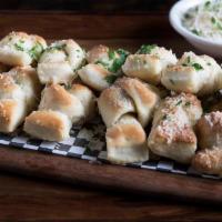 Pete'S Famous Knots · Our famous pizza dough is tied, baked and tossed in a garlic butter glaze, then topped with ...