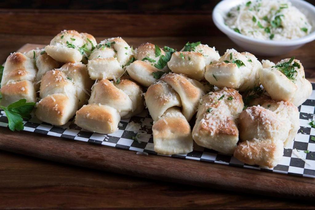 Pete'S Famous Knots · Our famous pizza dough is tied, baked and tossed in a garlic butter glaze, then topped with fresh parmesan cheese. (Also available with cinnamon sugar glaze)