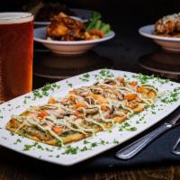 Pete'S Garden Flatbread · A colorful vegetarian delight! Garlic olive oil and parmesan cheese topped with mushrooms, r...