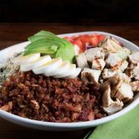 Cobb Salad · Turkey, avocado, bacon, bleu cheese crumbles, diced tomatoes and sliced egg piled on a bed o...