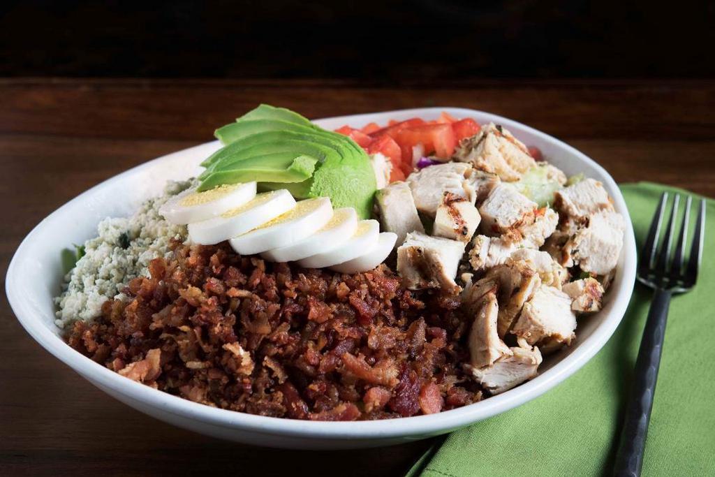Cobb Salad · Turkey, avocado, bacon, bleu cheese crumbles, diced tomatoes and sliced egg piled on a bed of garden fresh lettuce. Served with your choice of dressing!