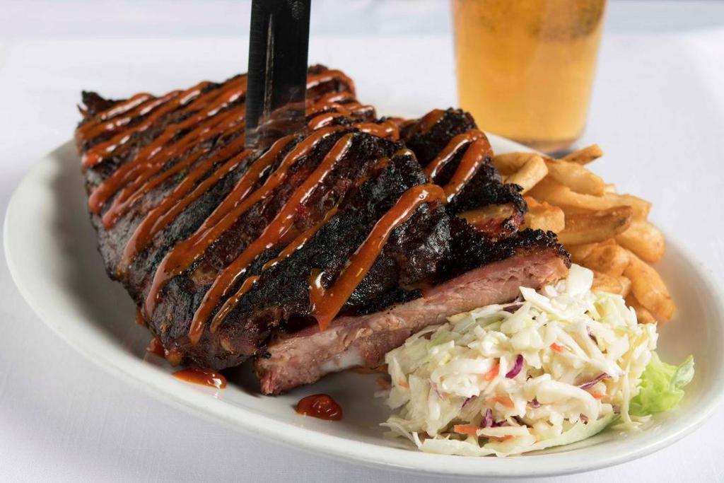 Bbq St. Louis Ribs · BBQ pork ribs slow roasted to perfection and basted with our famous homemade BBQ sauce. Served with French fries and coleslaw