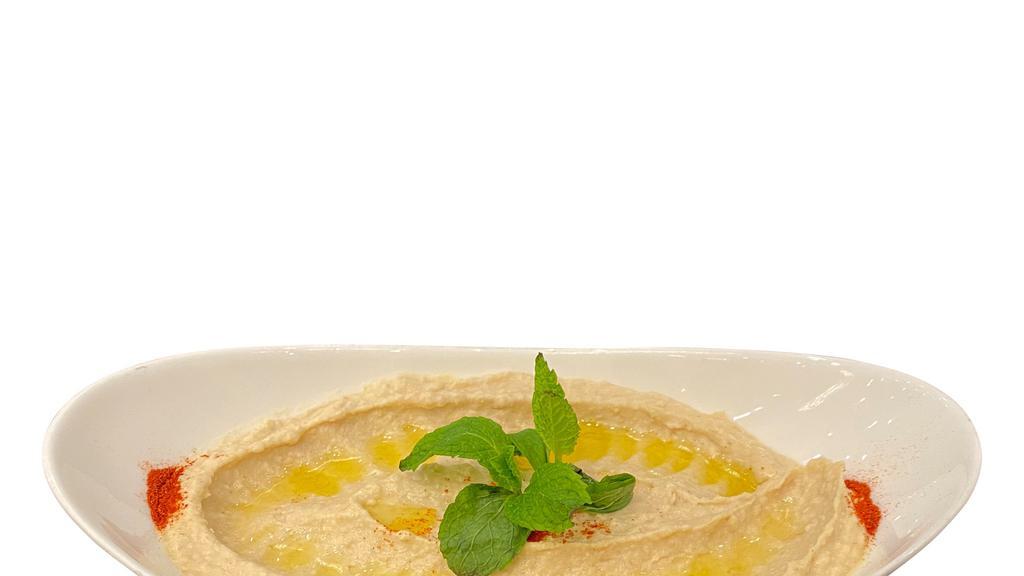 Hummus · garbanzo beans, tahini, lemon juice, olive oil.