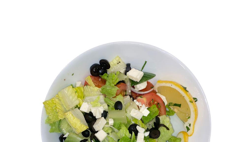 Greek Salad · Romaine lettuce, tomatoes, cucumbers, olives, onion, feta cheese, mixed with our special.