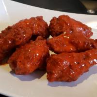 Bourbonwild Wangz · Crispy Chicken wings w/ kicking bourbon sauce and glaze!