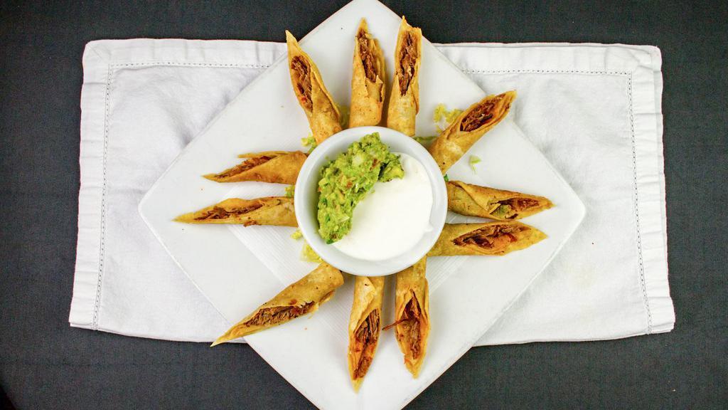 Taquitos · Six crispy flour tortillas filled with chicken or beef served with guacamole and sour cream.