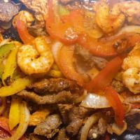 Shrimp Fajitas · Shrimp with bell peppers, onions and tomatoes. Served with guacamole salad, two tortillas, r...