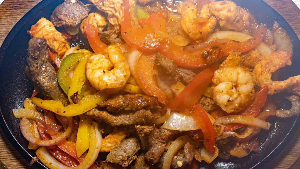 Shrimp Fajitas · Shrimp with bell peppers, onions and tomatoes. Served with guacamole salad, two tortillas, rice and beans.