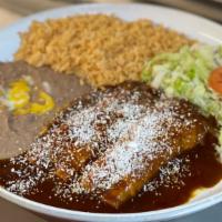 Enchiladas De Mole · Enchiladas in tasty mole sauce.