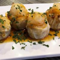 Jumbo Shrimp Shumai (4Pc) · whole shrimp baked on jumbo-sized shrimp dumplings w/rollin sauce