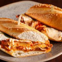Chicken Parmesan Sandwich · Breaded chicken breast drenched with creamy mozzarella and marinara sauce served on a fresh-...