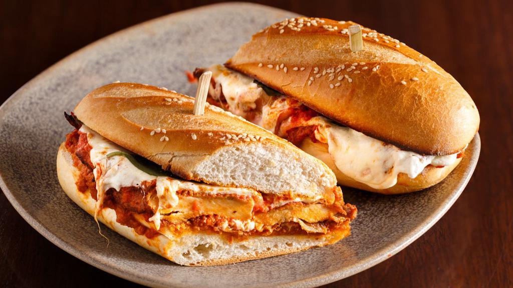 Chicken Parmesan Sandwich · Breaded chicken breast drenched with creamy mozzarella and marinara sauce served on a fresh-made Italian roll.
