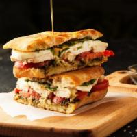 Grilled Chicken & Pesto Sandwich · Grilled chicken with fresh mozzarella, tomatoes, lettuce and homemade pesto sauce.