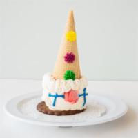 Clown Cones (Vanilla Only) · A Scoop of Vanilla Ice Cream on a chocolate wafer with a sugar cone on top decorated as a fr...