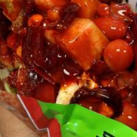 Tostilocos · Tostitos chips, cueritos, cucumber, jicama, lime, Valentina hot sauce, chamoy, tajin and Jap...