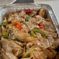 Drunken Noodle · Stir fried your choices of meat with flat rice noodles, bell peppers, onion, string bean, ba...