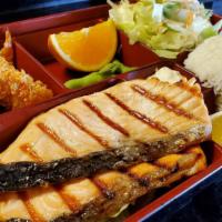 Broiled Salmon Meal · Flamed-grilled salmon served with ponzu sauce, rice, and salad.