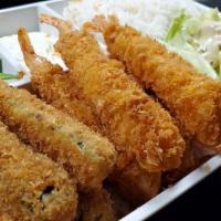 Fried Jumbo Shrimp Meal · Panko-battered shrimp and zucchinis, served with rice and salad.