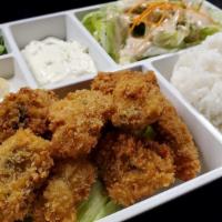 Fried Oysters Meal · Panko-battered oysters served with rice and salad.