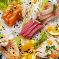 Sashimi Mix Combination · 15 pieces chef's choice served with rice and salad.