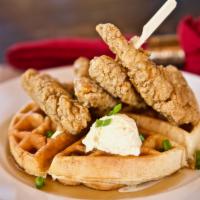 Chicken & Waffles · Waffle and crispy chicken pepper strips with green onion with butter and syrup.