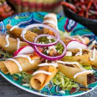 Taquitos · Shredded Beef or Chicken rolled up in a corn tortilla
