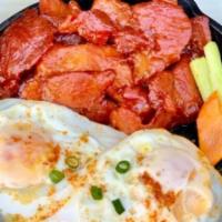 Tosilog · Pork slices in sweet, garlic marinade (aka Filipino bacon) served over a bed of flavorful ho...
