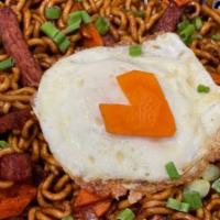 Spicy Korean Noodle · Korean Ramen noodles in a savory and spicy seafood and black bean sauce with SPAM strips sau...