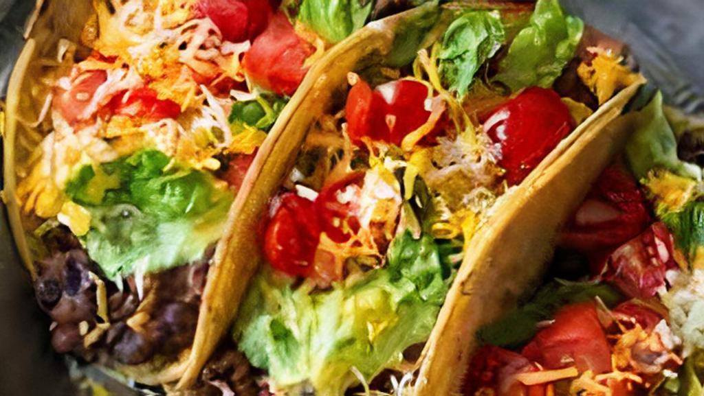 Veggie Bean Taco · Vegetarian. Black beans cooked with green olives and red bell pepper, corn tortilla, lettuce, red onion, cilantro, feta cheese.