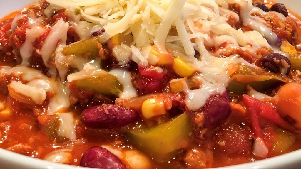 Spicy Veggie Bean Chili · Vegetarian. Includes feta cheese and diced red onion.