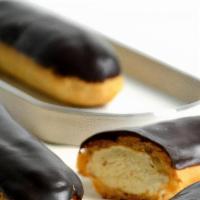 Chocolate Éclair (5.0'') · This delicate, oblong-shaped pastry with a beautiful dark-chocolate icing shell is embedded ...