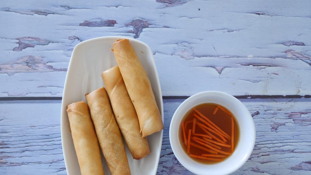 Crispy Rolls · Four fried rolls filled with carrots, jicama, vermicelli, taro, onion, and organic tofu with sweet and sour dip.