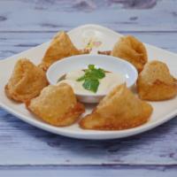 Golden Wonton · Six crispy vegan cheese wonton with chef's special sauce.