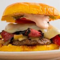 Pastrami Burger · Topped with seasoned grilled pastrami, sauteed onions, tomato, pickle chips. Swiss cheese an...