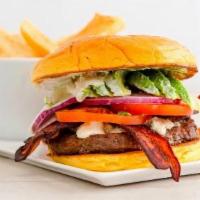 Black And Blue Burger · Thick-cut bacon, bleu cheese crumble, avocado, tomato and red onion with bleu cheese dressing.
