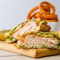 The Turkey Pesto · Oven-roasted turkey, avocado, grilled tomato, muenster cheese and canter's pesto sauce on so...