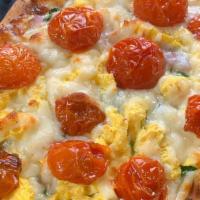 Breakfast Naan Pizza · Personal size naan pizza with olive oil, mozzarella cheese, ground basil, scrambled eggs, sp...