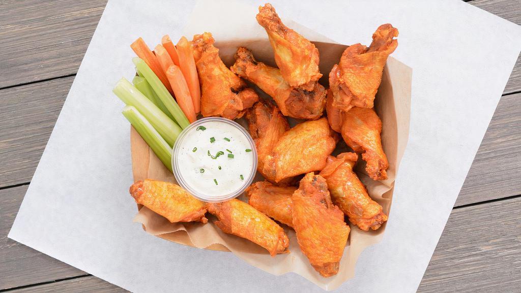 12 Classic Bone-In Wings · 12 Classic bone-in chicken wings tossed with wing sauce and served with fresh carrot & celery sticks and ranch or blue cheese dressing