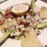 Ceviche Los Compadres · A plate of ceviche accompanied with chips and topped with fresh avocado slices. Your choice ...