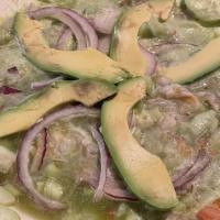 Aguachile · Raw shrimp cooked in lemon juice, jalapeño, red onions, and cucumber.