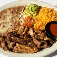 Carnitas · Tender chunks of oven-roasted pork cooked in its own juices. Served with rice, beans, pico d...