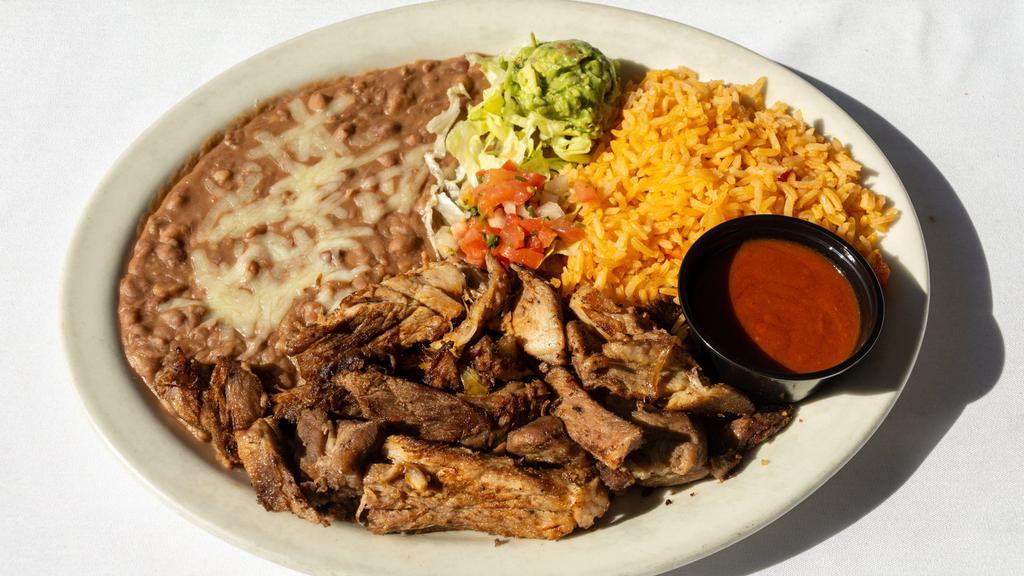 Carnitas · Tender chunks of oven-roasted pork cooked in its own juices. Served with rice, beans, pico de gallo and guacamole. Add soup or salad for an additional charge.