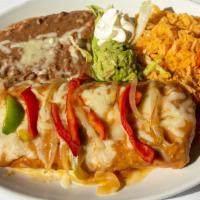 Fajitas Chimichanga · Steak or chicken fajitas wrapped up in a large fried flour tortilla and topped with ranchera...