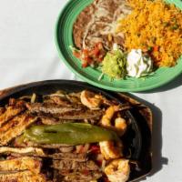 Parrillada Mexicana · This trio fajita has tender strips of grilled chicken, grilled steak, and large grilled juic...