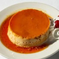 Flan · Our very own homemade flan topped with whipped cream.