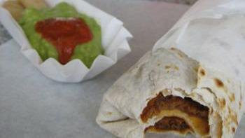 Tortilla Dog Burrito · Refried beans, cheddar cheese and a 1/4 lb all beef hot dog wrapped in a grilled tortilla.