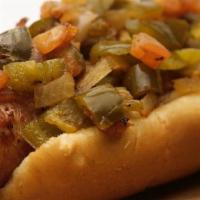 Chili Cheese Dog · Chili and cheddar cheese smothered on a hot dog served with mustard, relish and onions. Serv...