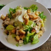 Chicken Caesar Salad · Grilled free range chicken breast, organic romaine, dressing, and shaved Parmesan.