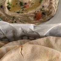 Hummus Classic · Garbanzo beans and sesame tahini with a touch of garlic, virgin olive oil, lemon juice toppe...